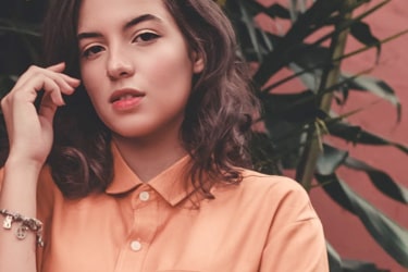 A lady in an orange shirt